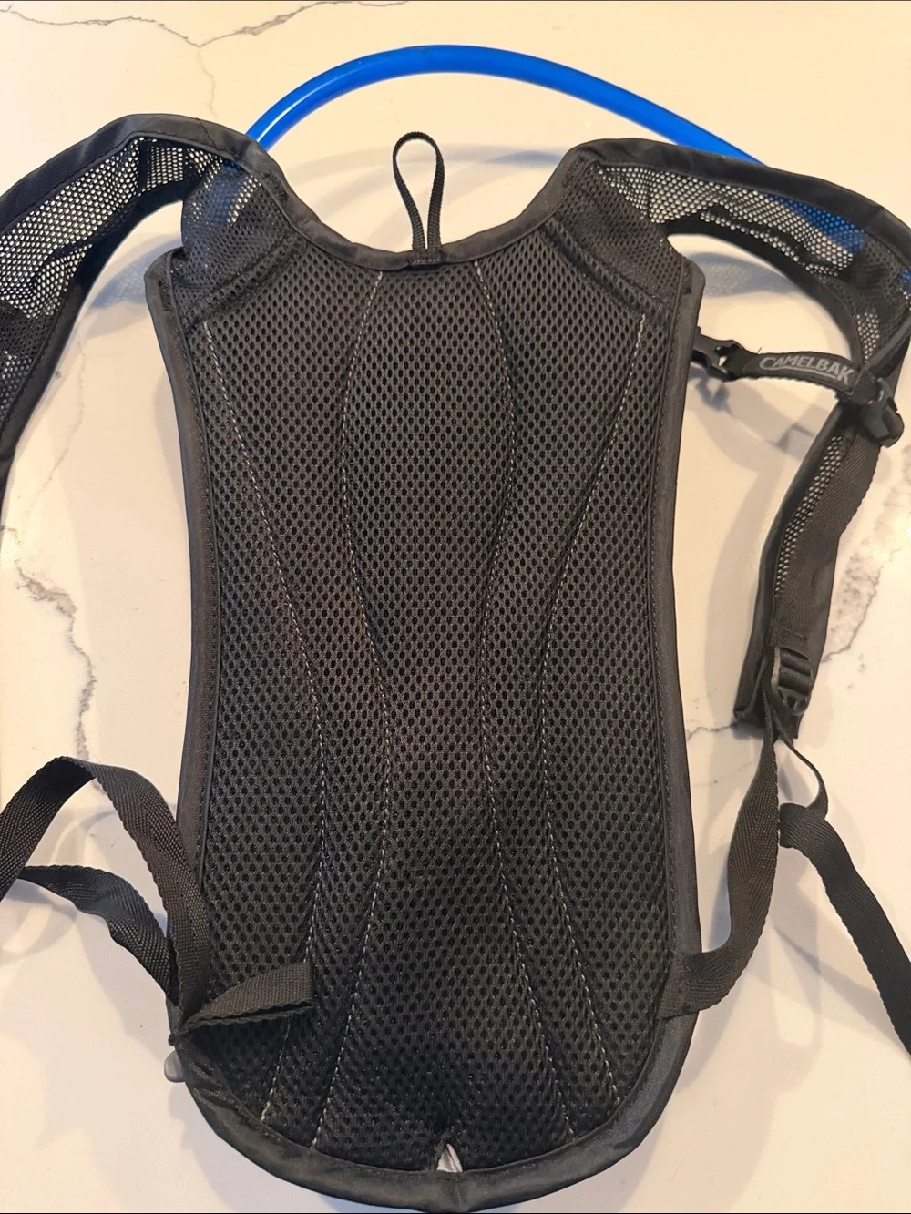 Camelbak Black Hydration Pack with Blue Drinking Tube
